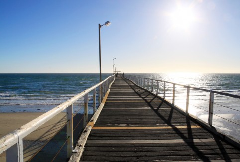Long Wooden Jetty in Strong Sunlight. Largs Bay Jetty, Adelaide